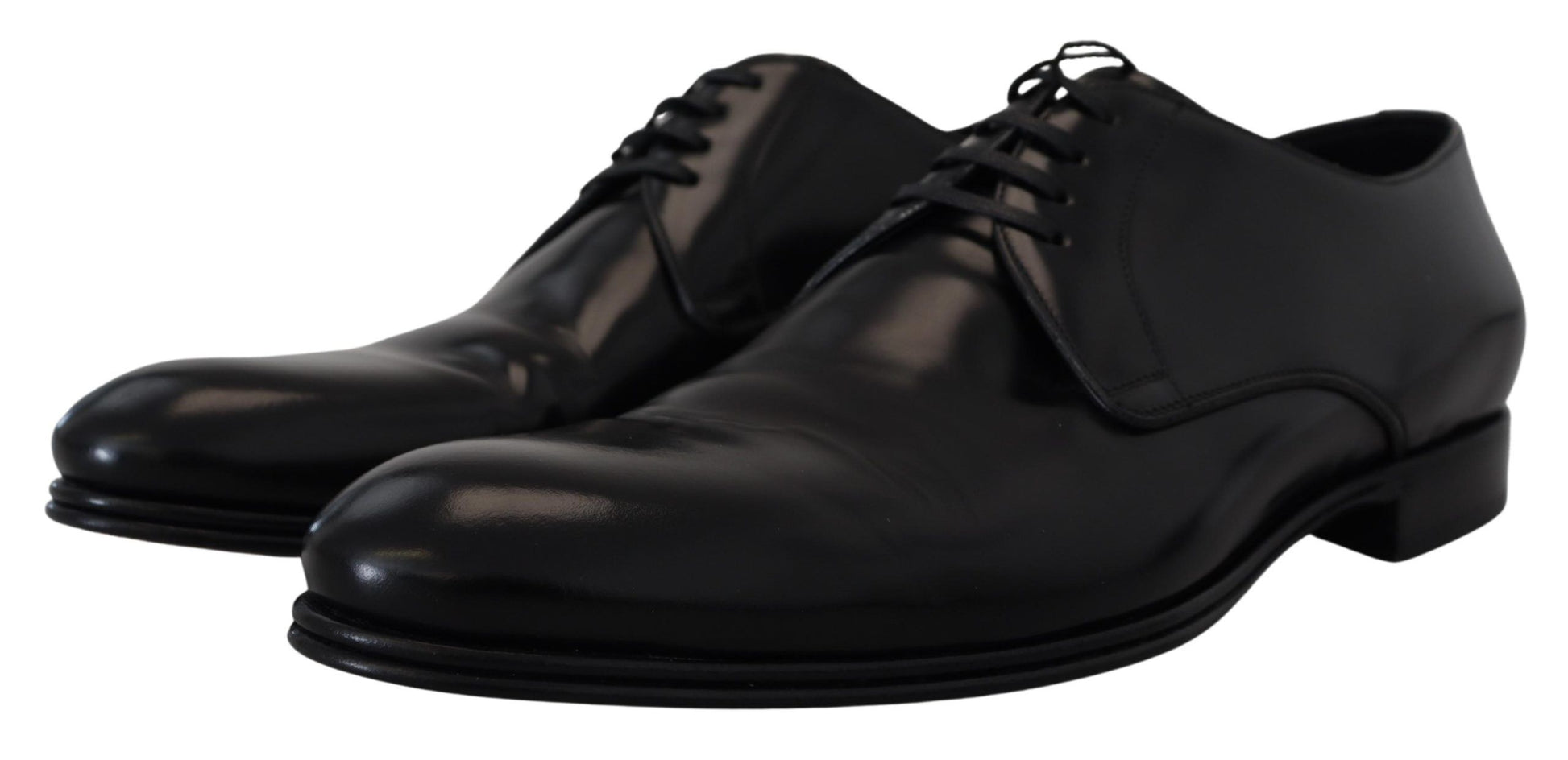 Pair of black dress shoes with laces and a shiny finish