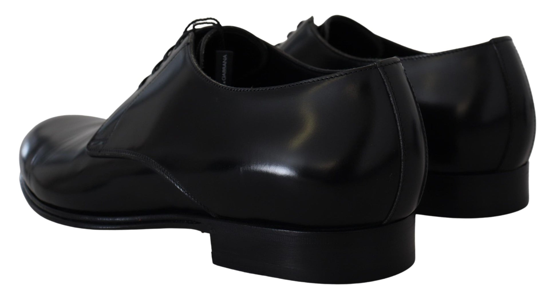 Pair of black dress shoes with laces and a shiny finish