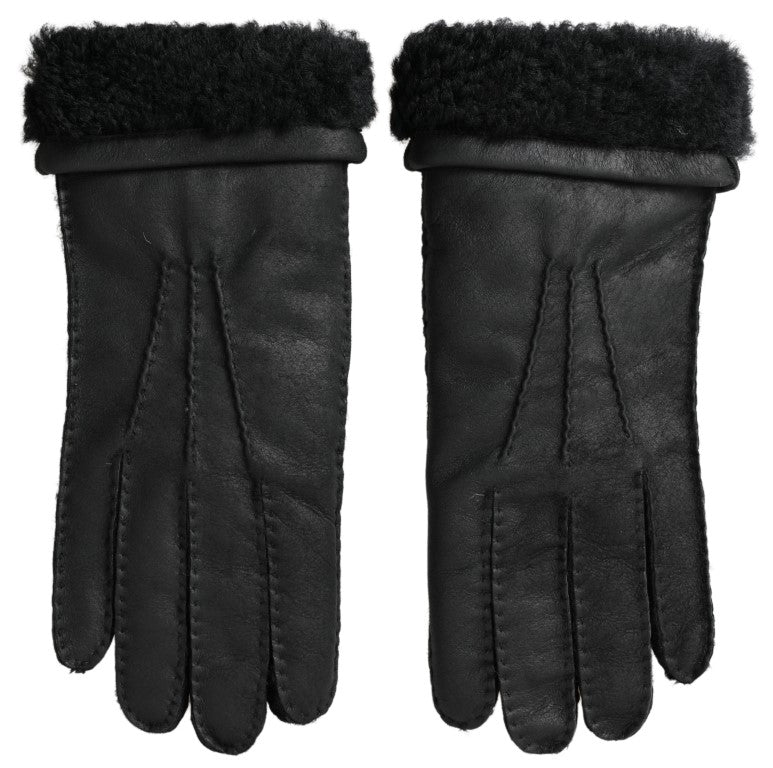 Pair of black leather gloves with fur trim