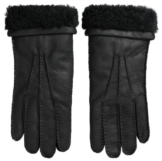 Pair of black leather gloves with fur trim