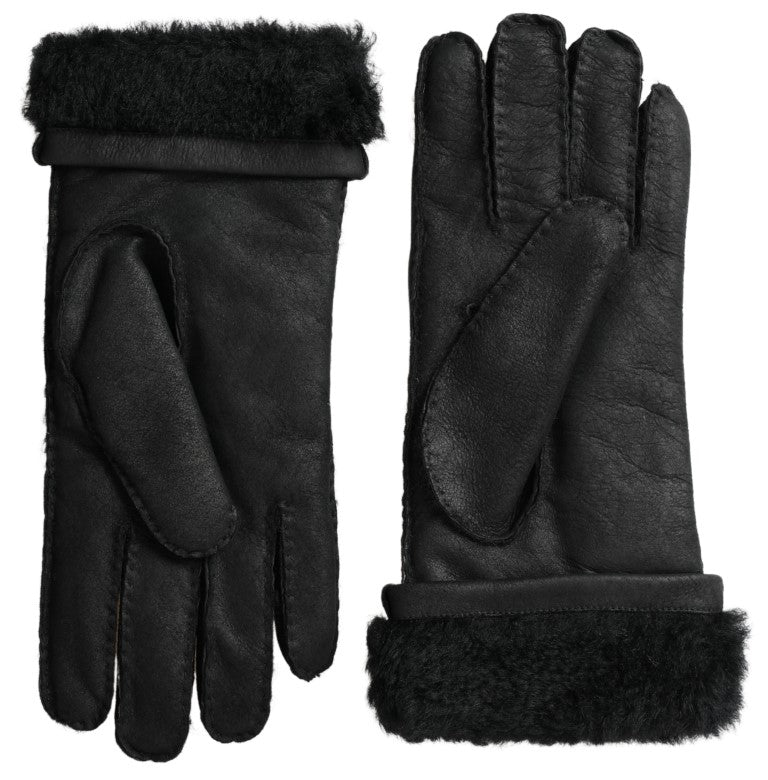 Pair of black leather gloves with fur trim