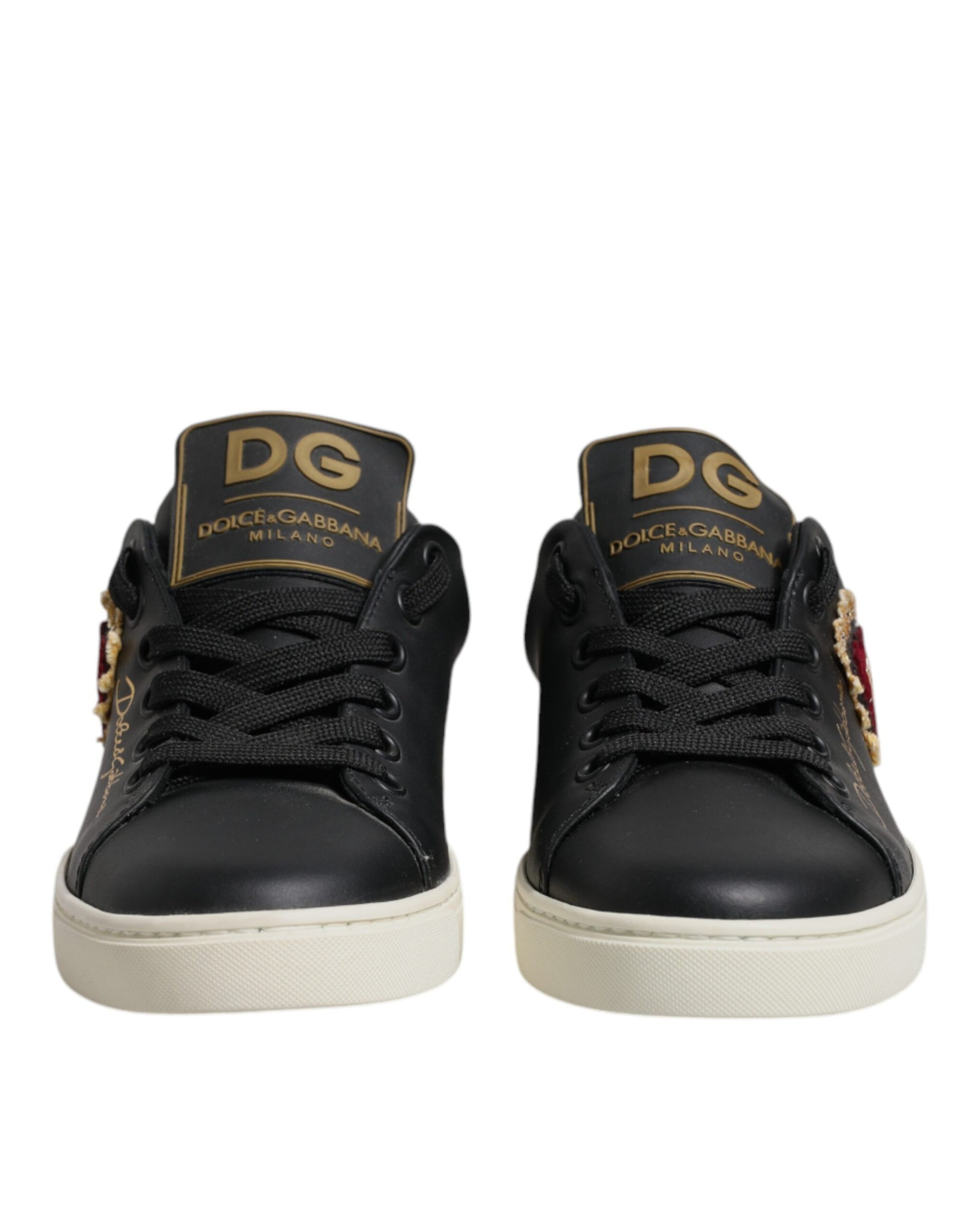 Black sneakers with gold lettering on side