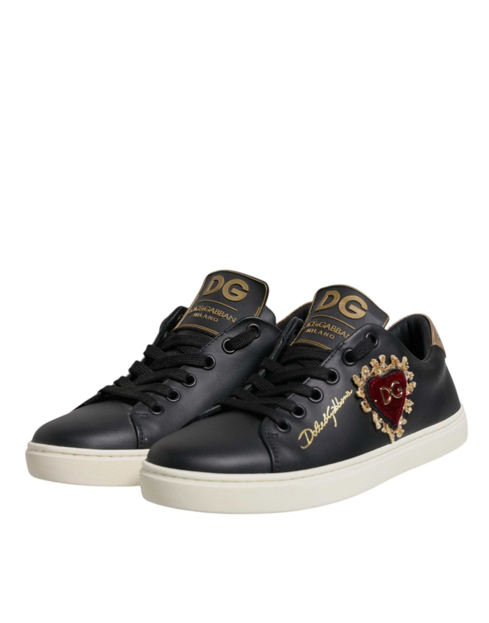 Black sneakers with gold accents and a heart design on the side