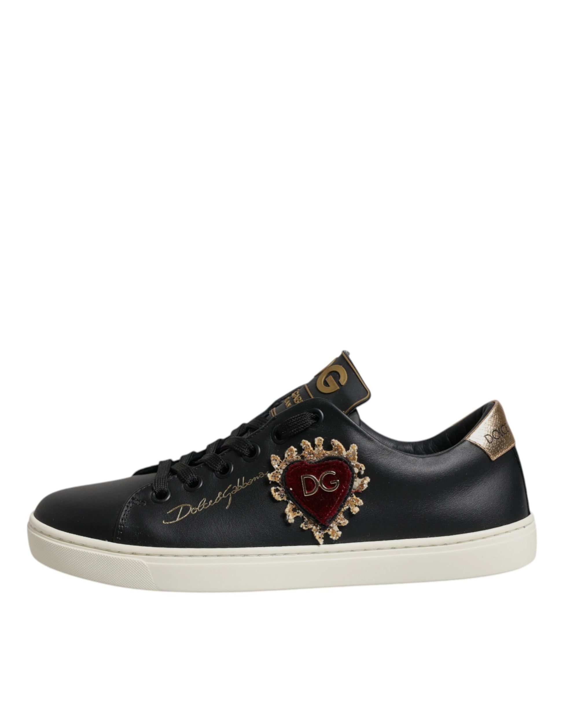 Black sneaker with gold accents and heart design on side