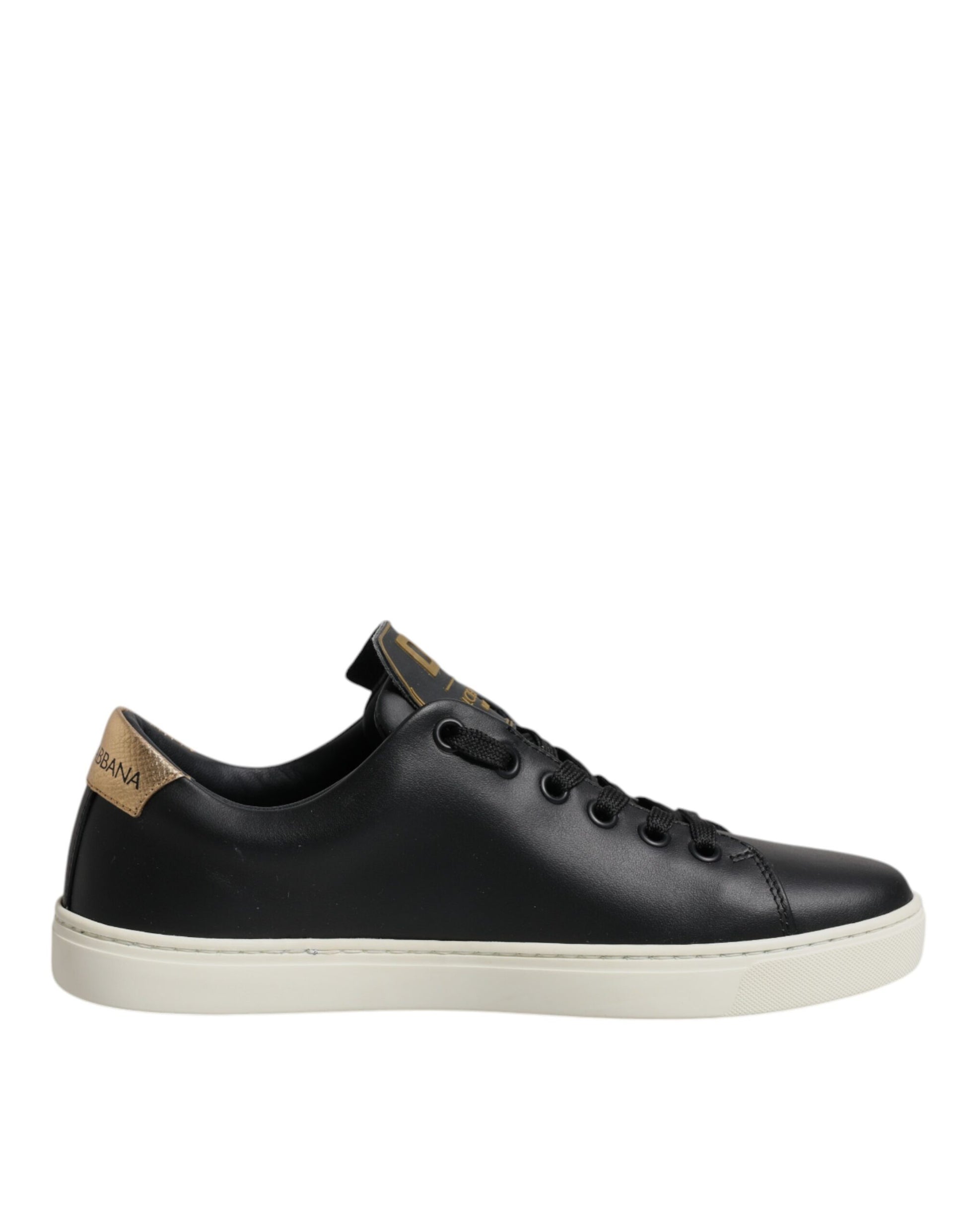 Black sneaker with white sole and gold accents