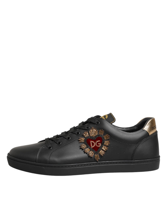 Black sneaker with gold accents and heart design on side