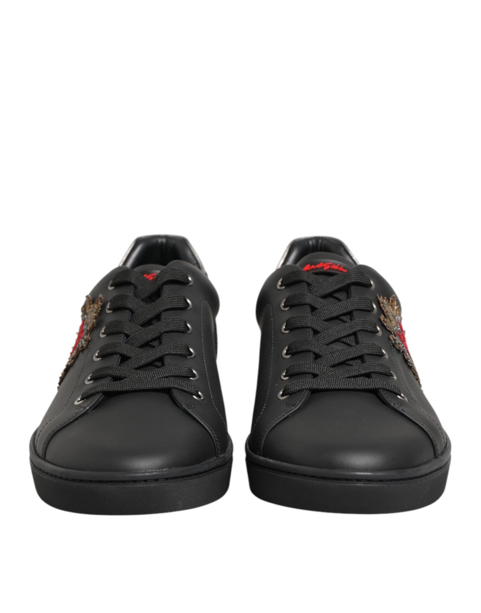 Pair of black sneakers with red logo on side