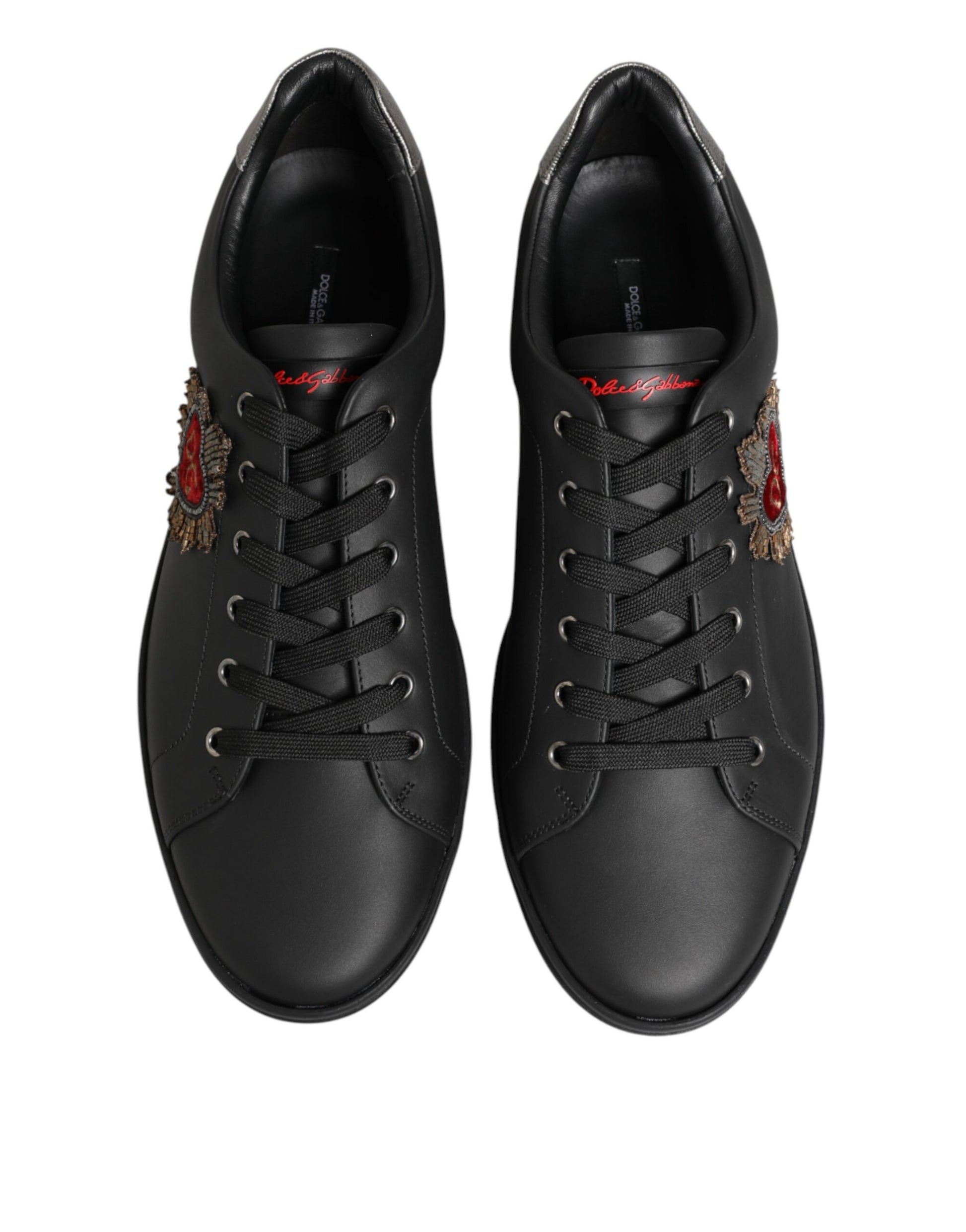 Pair of black sneakers with red accents