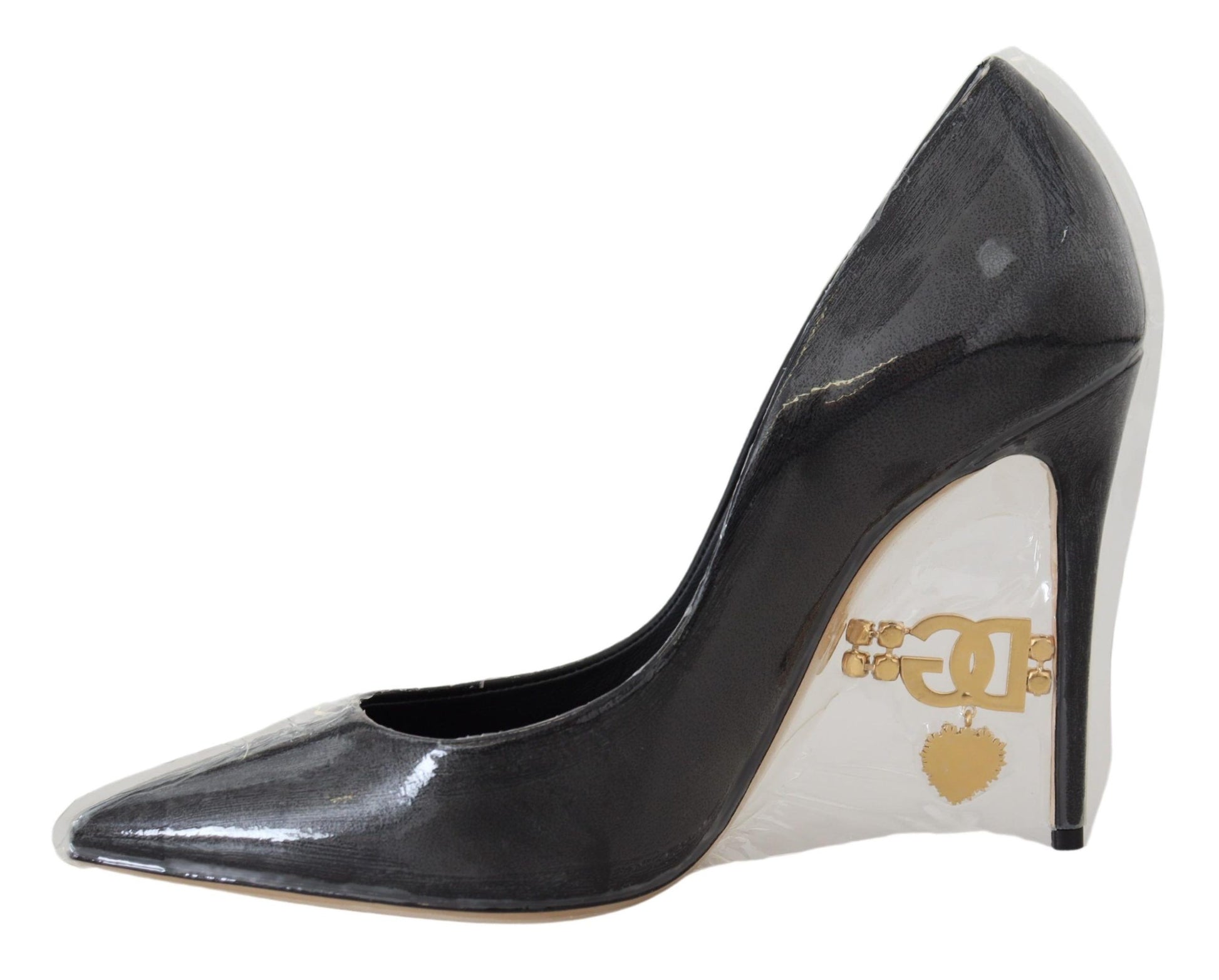 Black high heel shoe with gold buckle on toe
