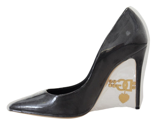 Black high heel shoe with gold buckle on toe