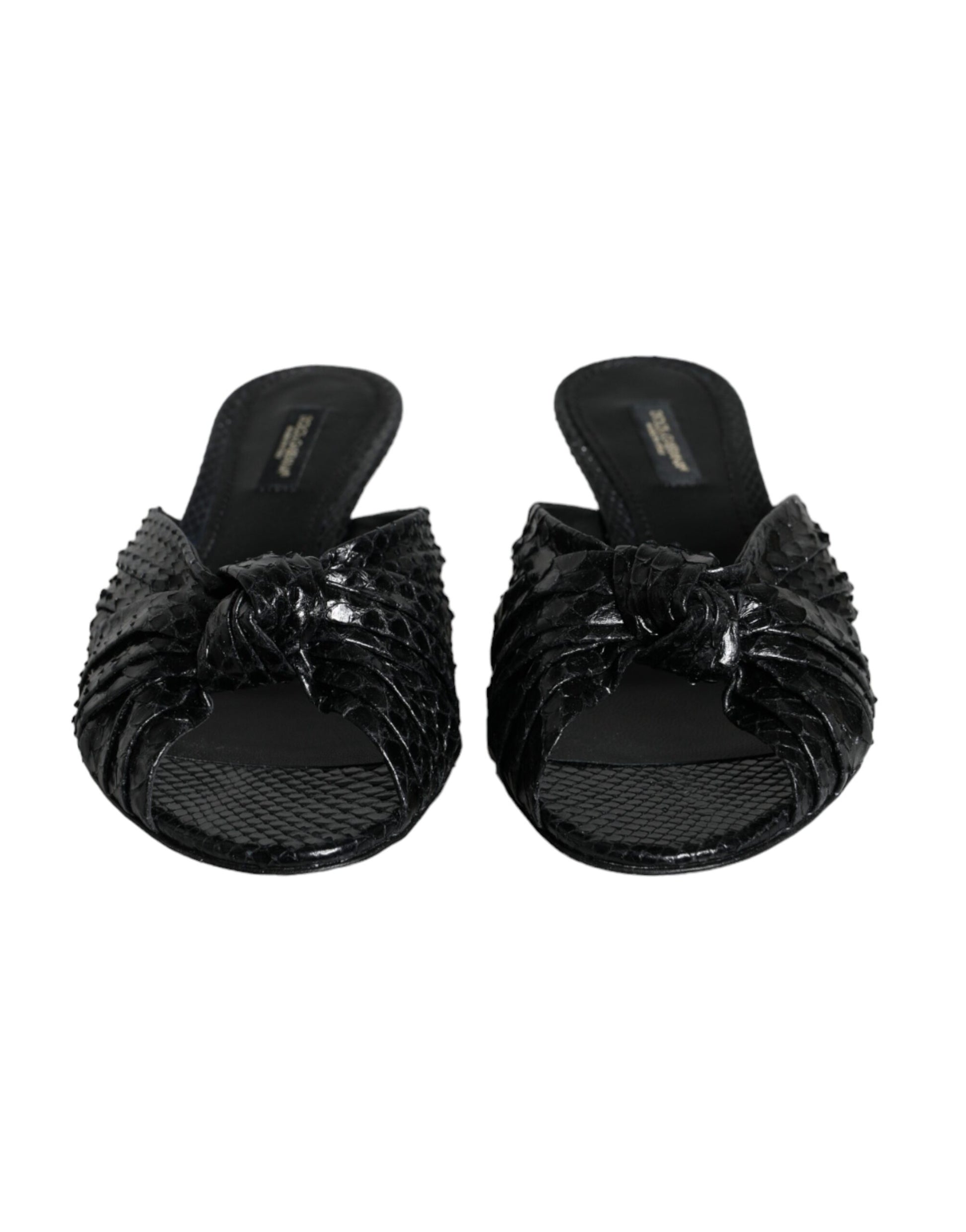 Pair of black glittery women's sandals with bow detailing