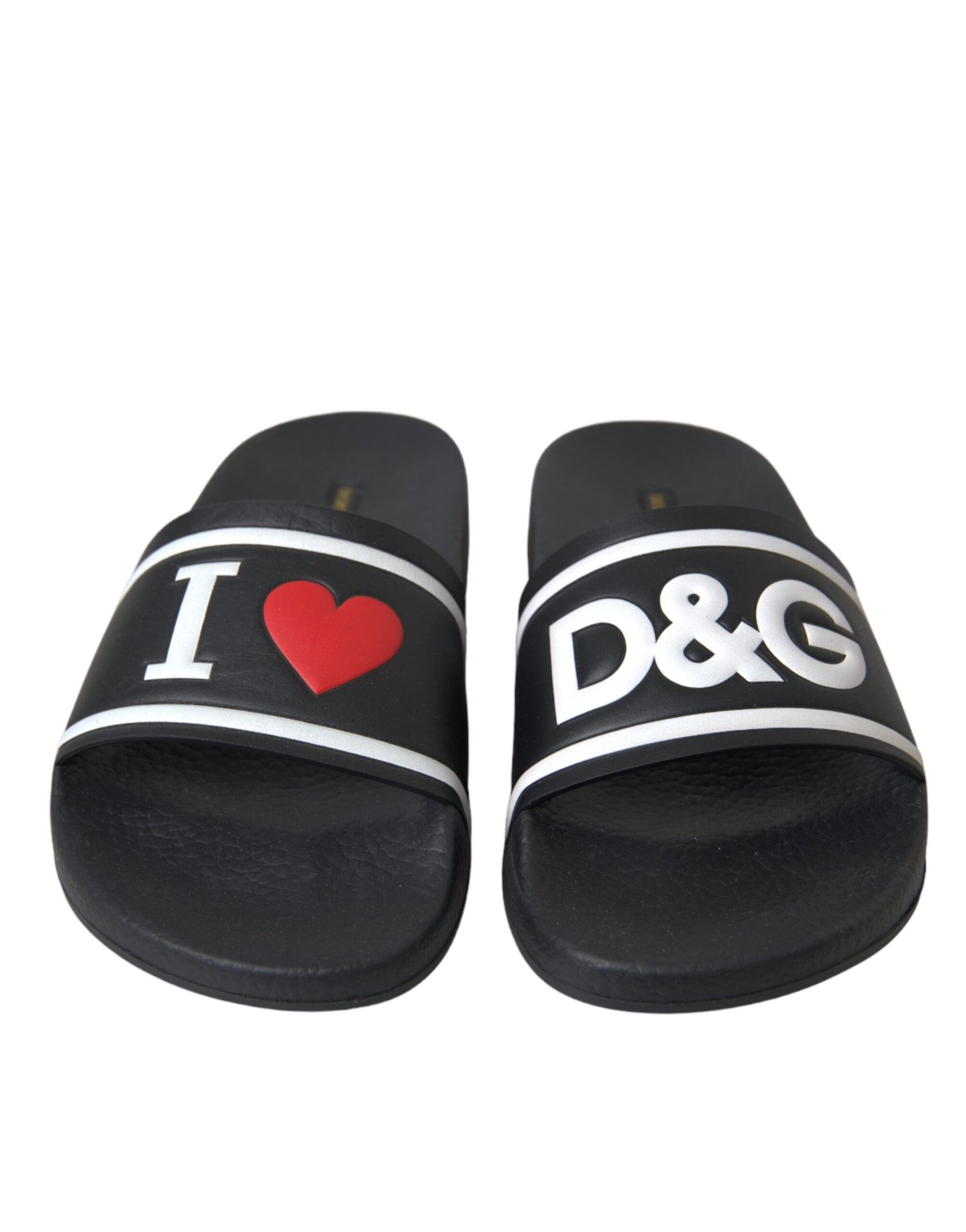 Pair of black flip flops with white lettering