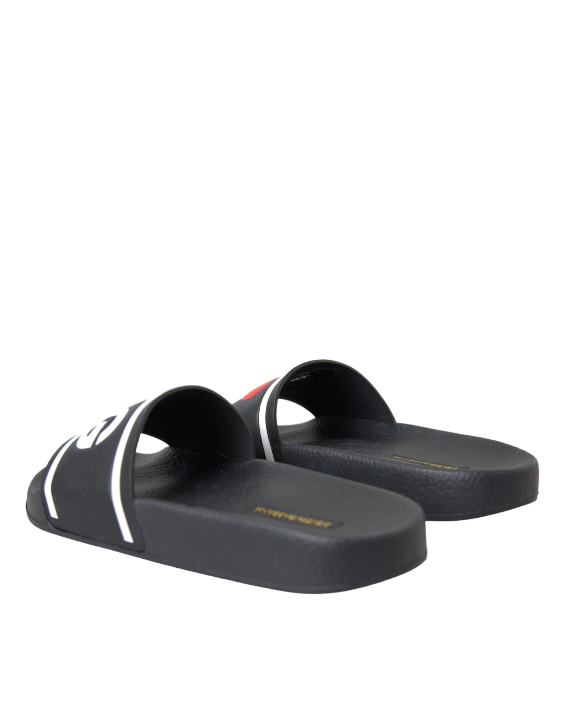 Pair of black sandals with white stripes on soles