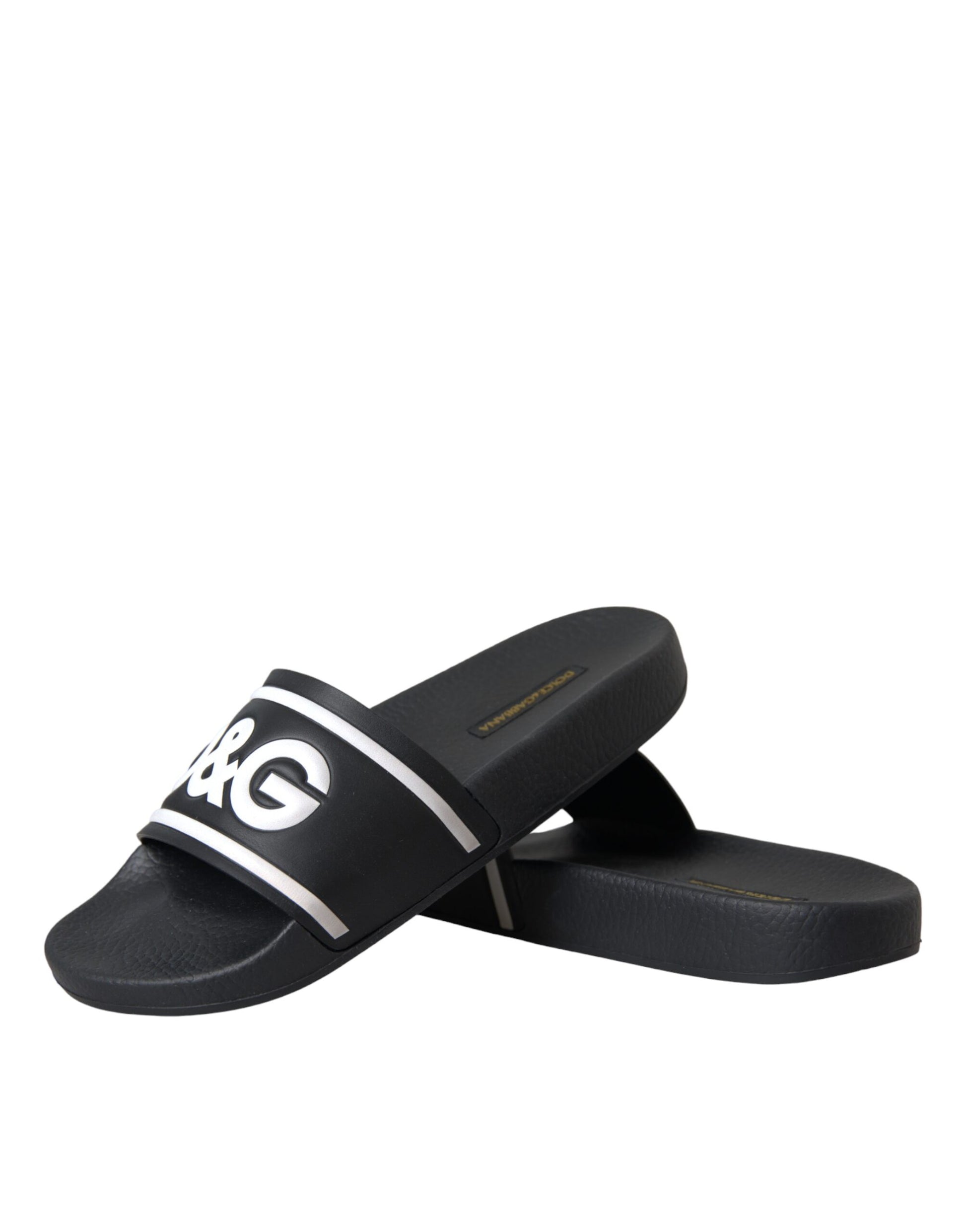 Pair of black sandals with white stripes on soles