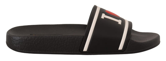 Pair of black sandals with white stripes and buckles