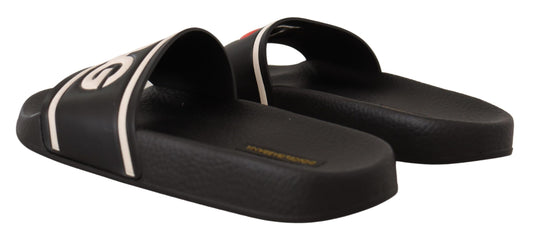 Pair of black flip flops with white straps and soles