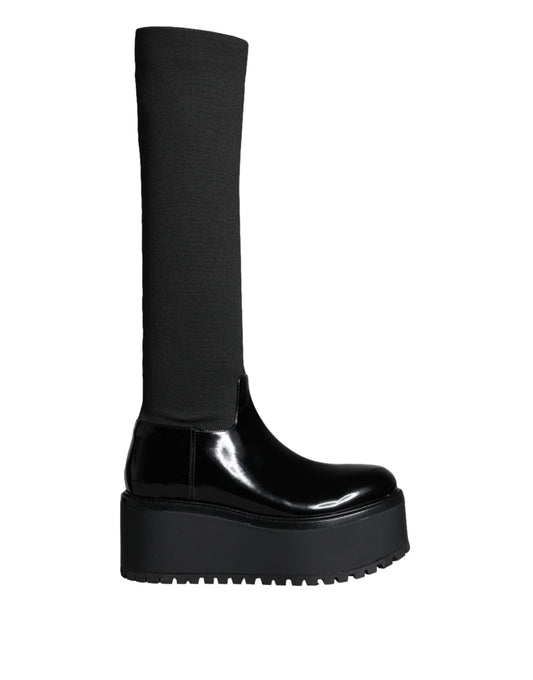 Black boot with high heel and black sock