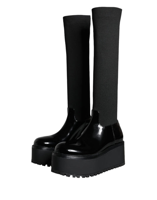 Pair of black knee high boots with thick soles
