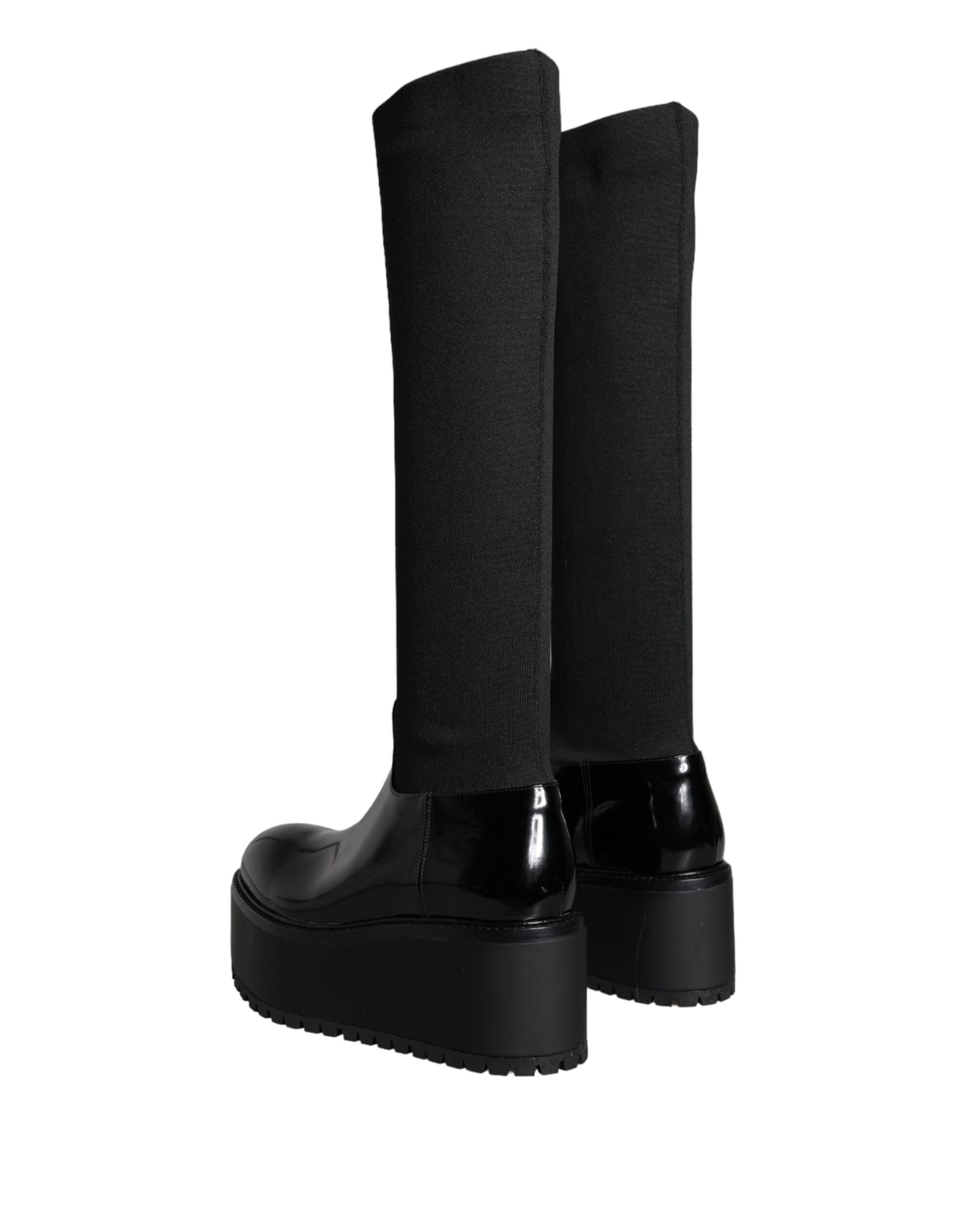 Pair of black knee high boots with heels