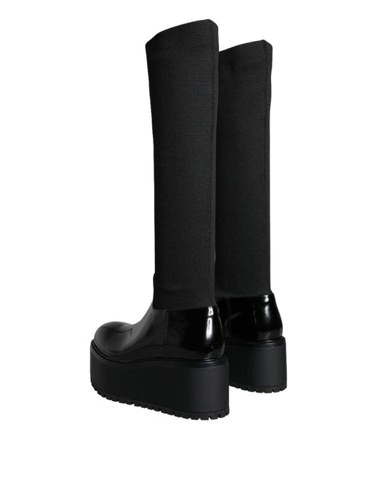 Pair of black knee high boots with heels