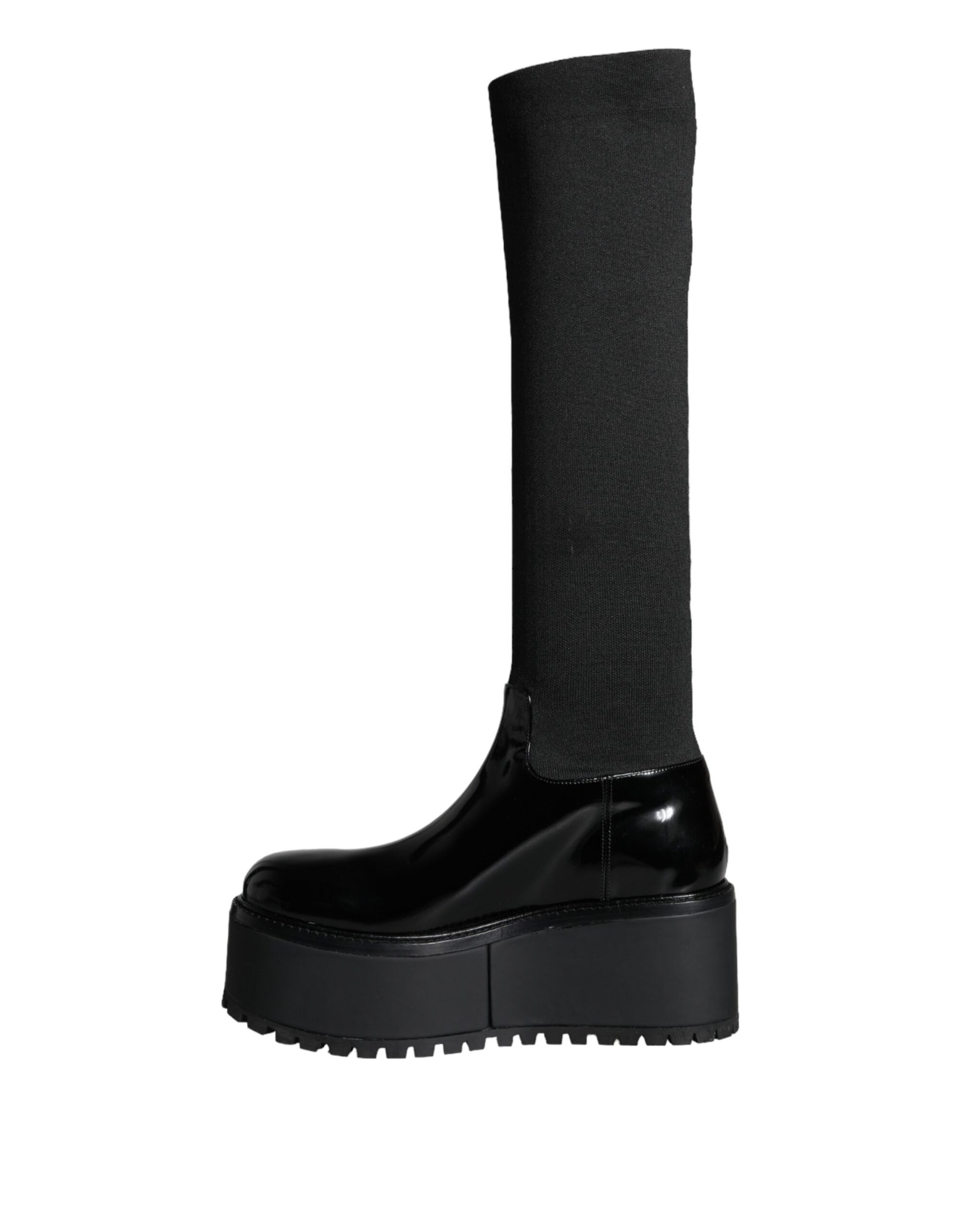 Black boot with high platform sole and black strap over top