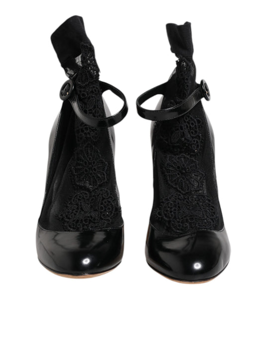 Pair of black high heel shoes with lace detailing