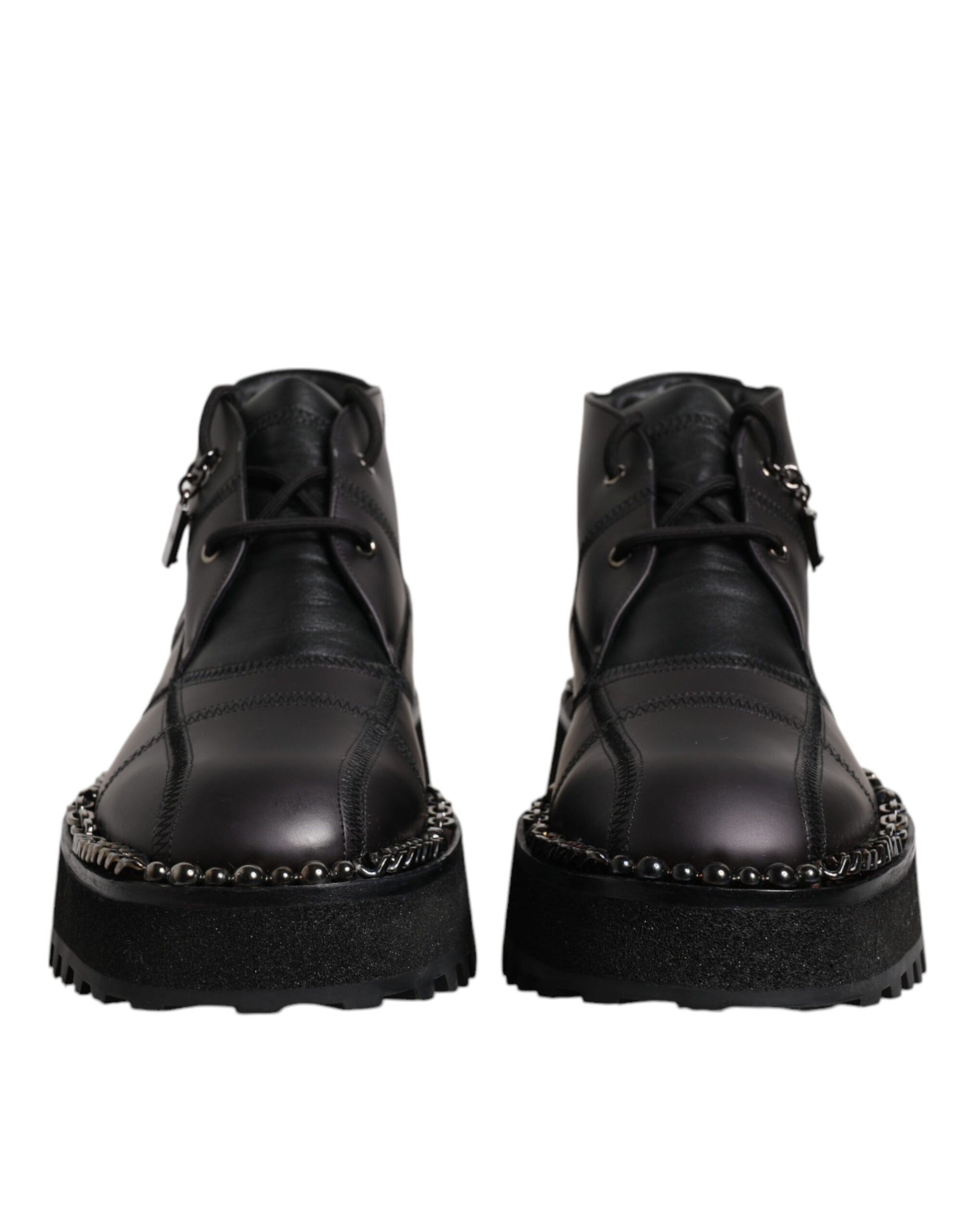 Pair of black leather boots with silver studs on sides