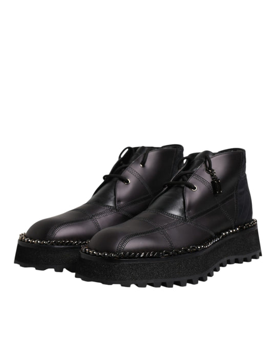 Pair of black boots with chunky heels and laces