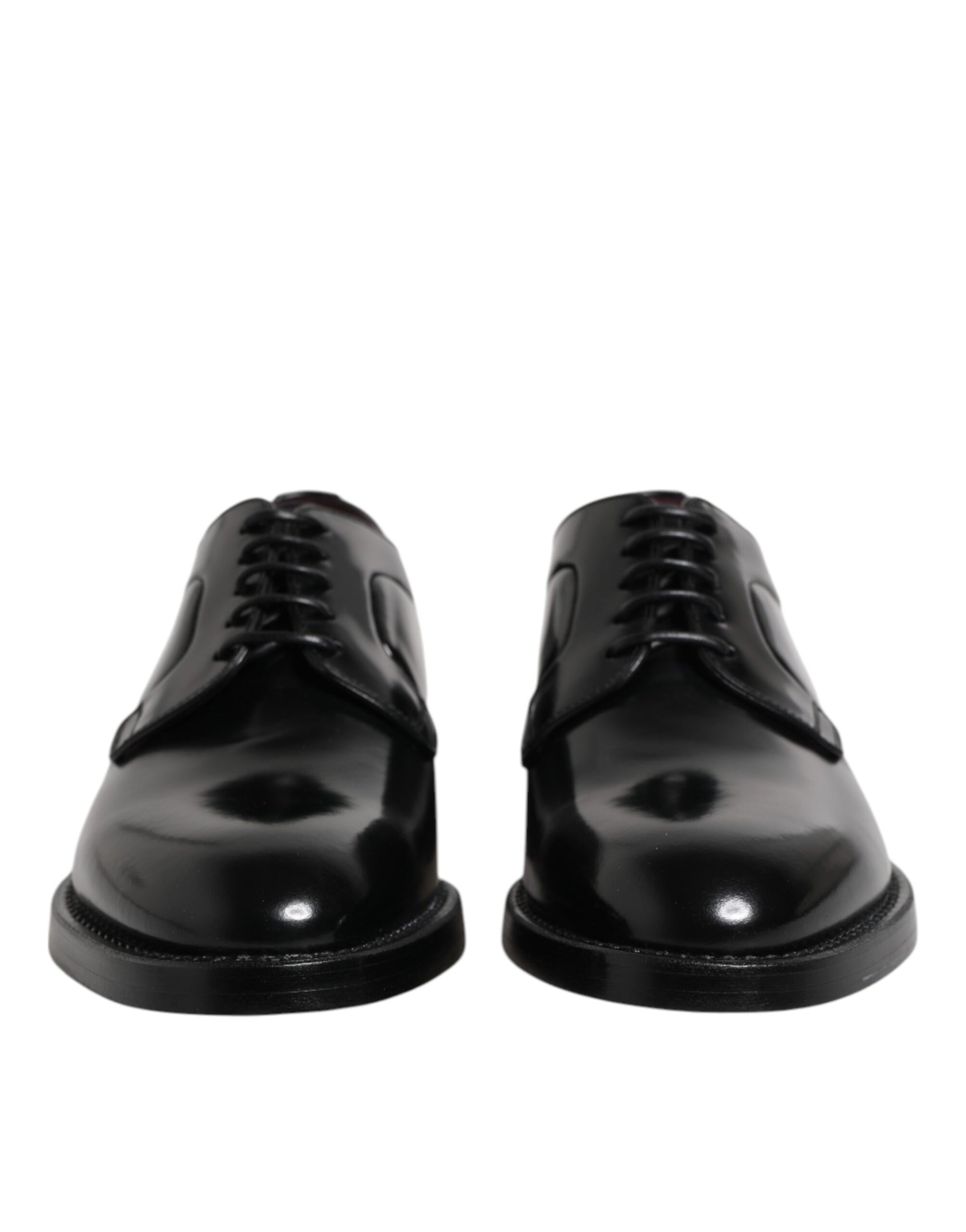 Pair of black leather lace-up dress shoes with a shiny finish