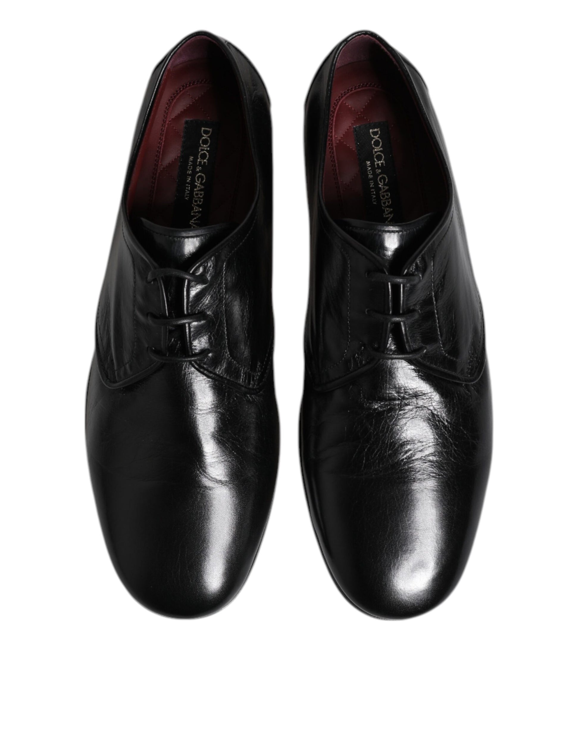 Pair of black leather lace-up dress shoes with silver buckles