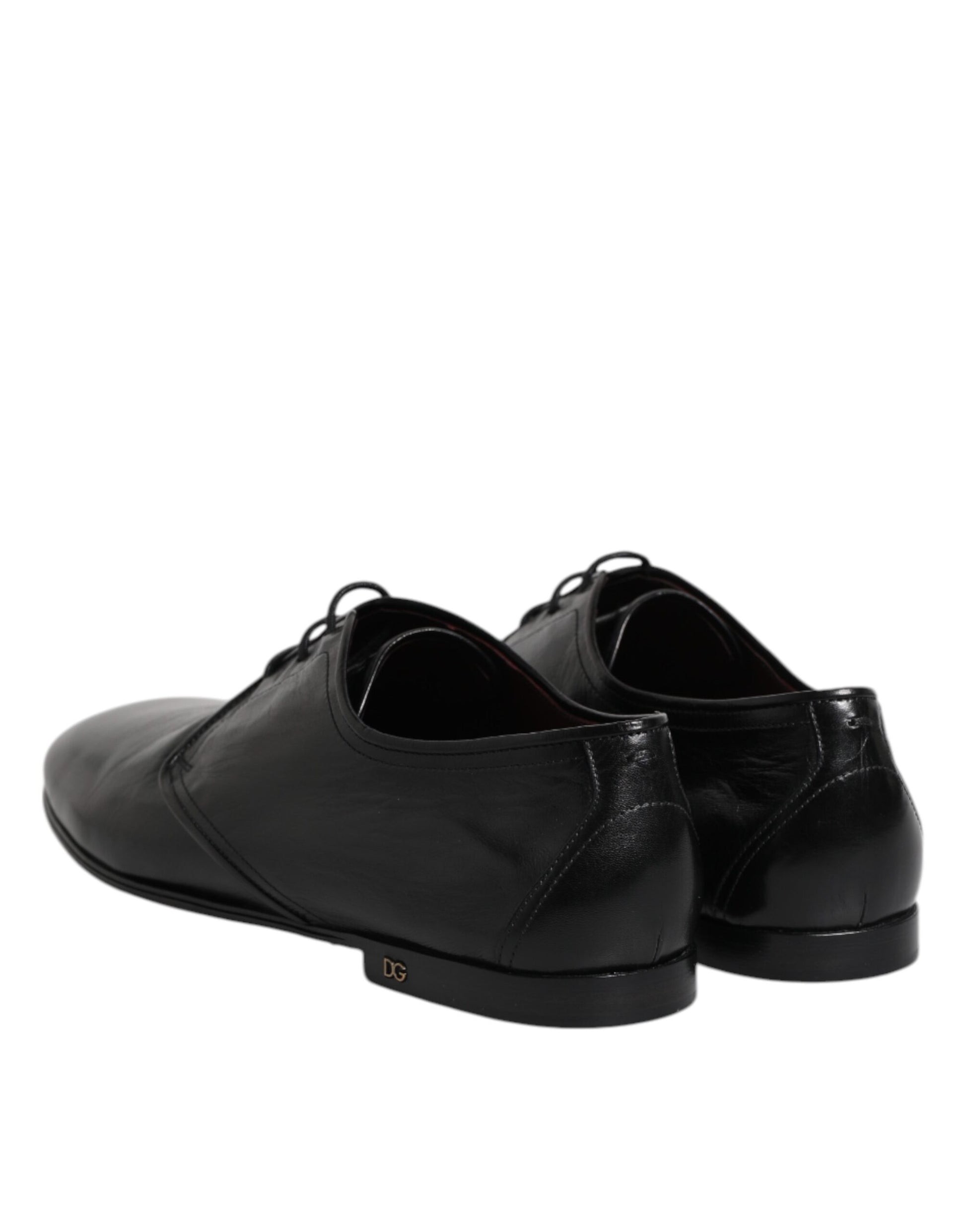 Pair of black leather lace-up dress shoes with a shiny finish