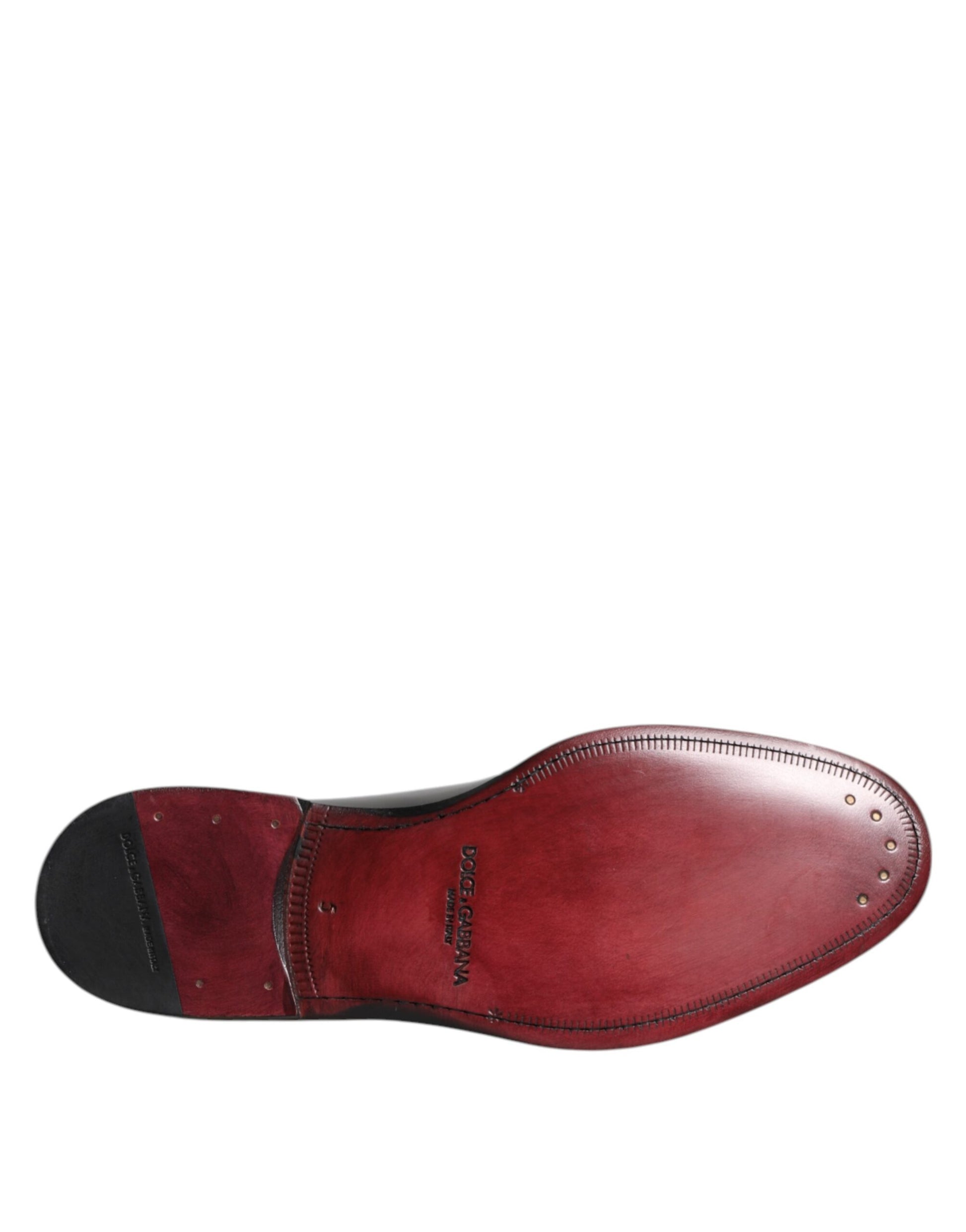 Red leather lace-up dress shoe with black stitching and silver eyelets