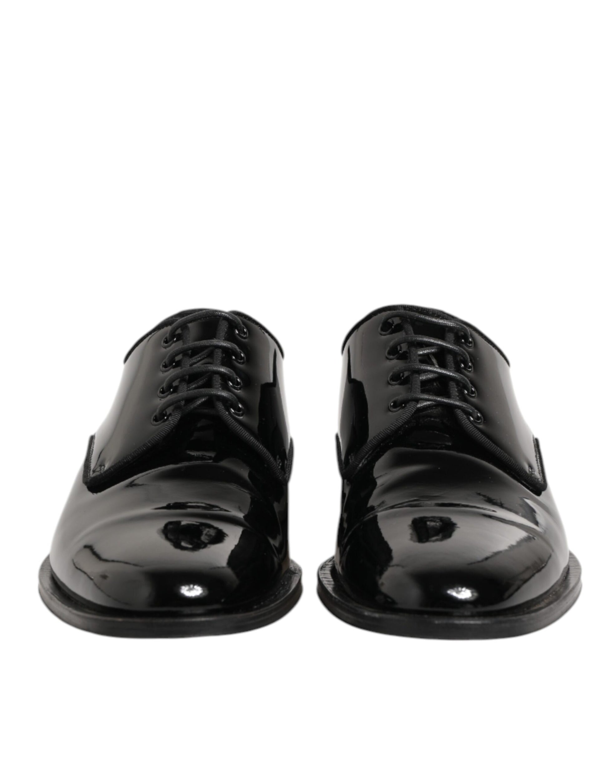 Pair of black leather lace-up dress shoes with a shiny finish