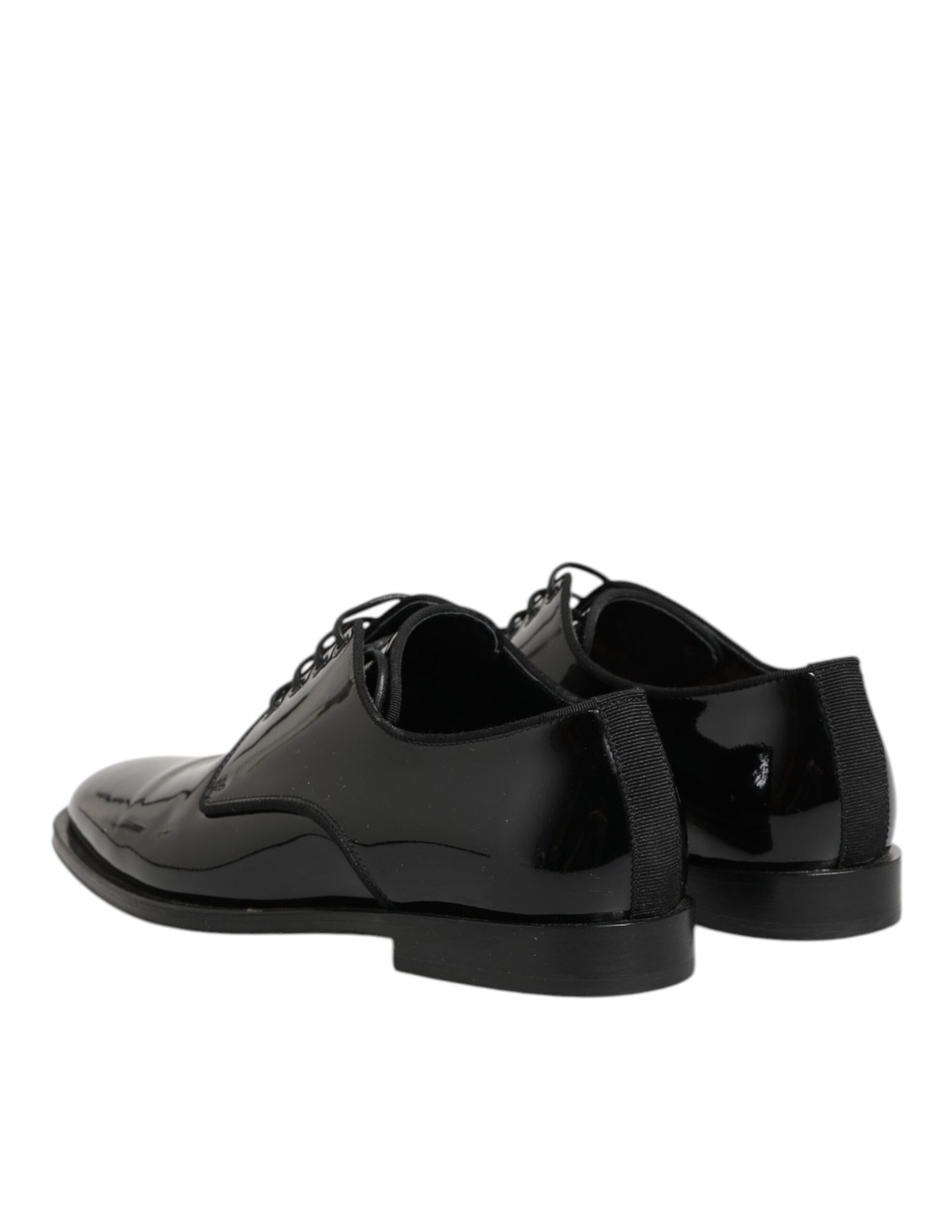 Pair of black leather lace-up dress shoes with a shiny finish