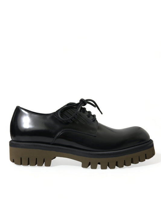 Black leather lace-up shoe with brown sole and heel