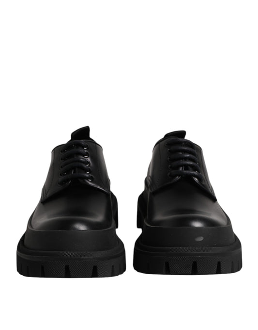 Pair of black leather lace-up dress shoes with rubber soles, designed by Dolce & Gabbana