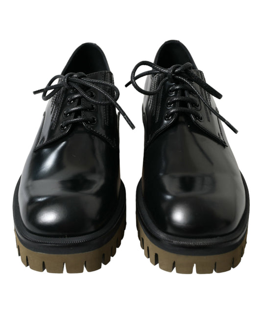 Pair of black dress shoes with laces and chunky heels
