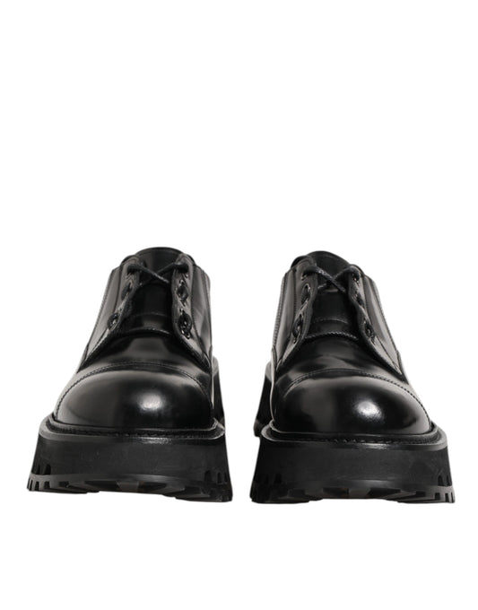 Pair of black leather lace-up dress shoes with a shiny finish, featuring a round toe and elastic panels for comfort