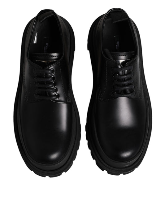Pair of black leather lace-up dress shoes with a low heel and elastic panels