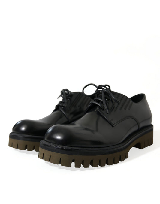 Black leather shoes with brown soles and laces