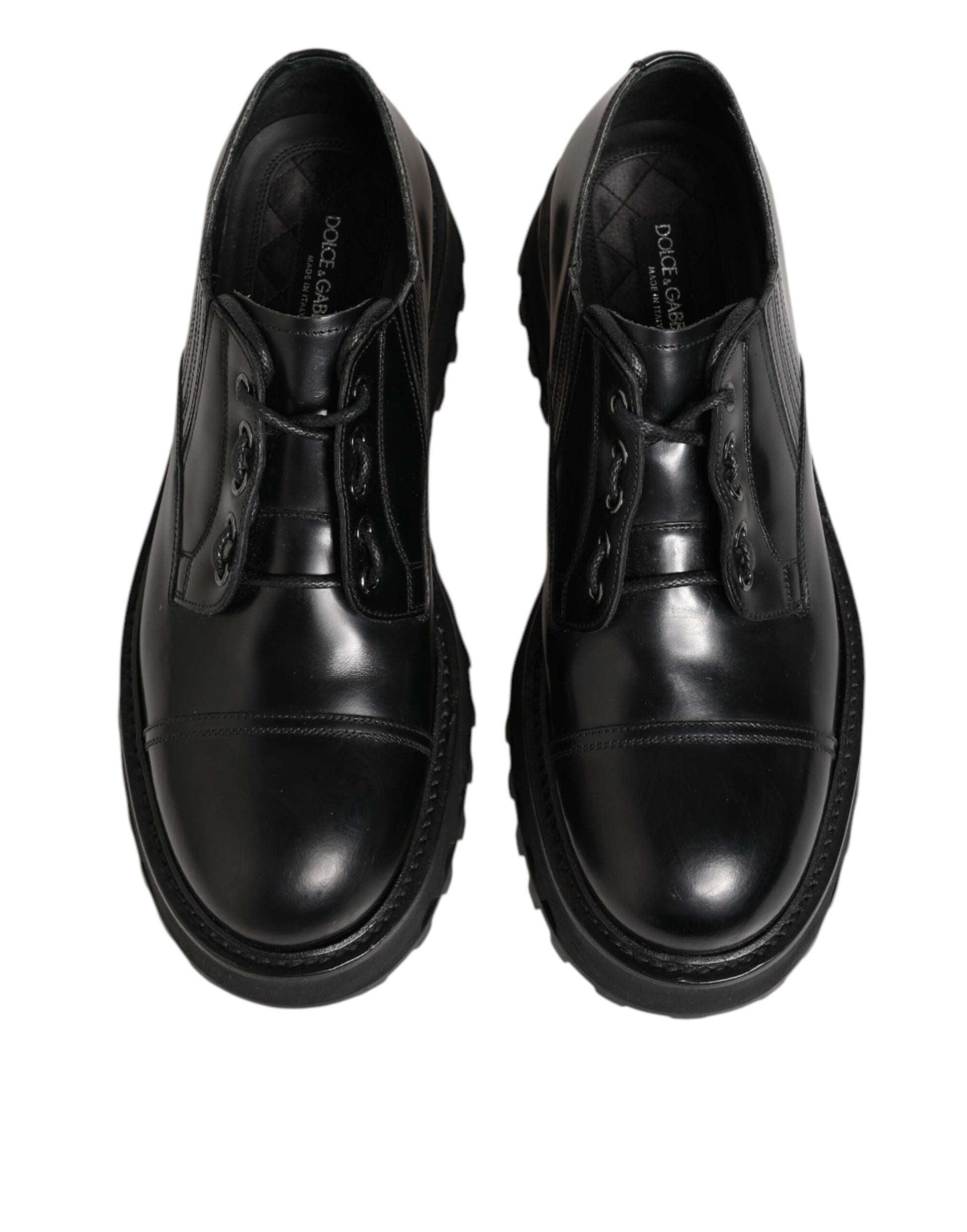 Pair of black leather lace-up dress shoes with a shiny finish, featuring a derby style design