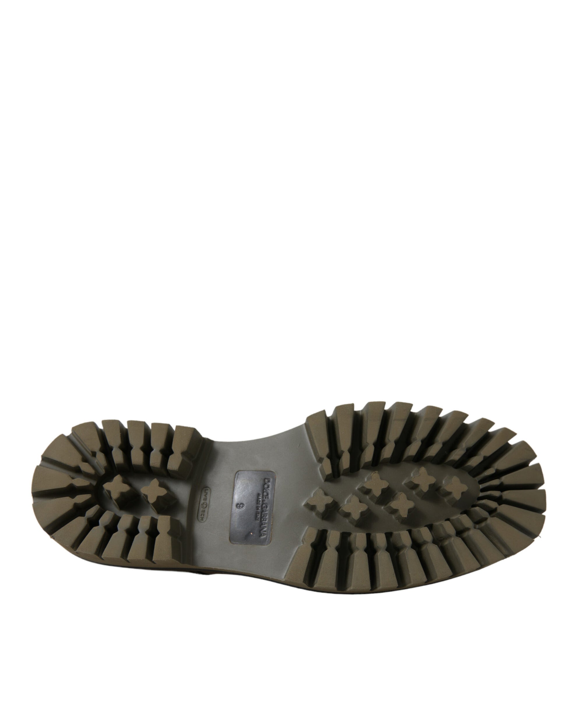 A single hiking boot with a deep tread pattern on the sole. It appears to be made of rubber or a similar material and is