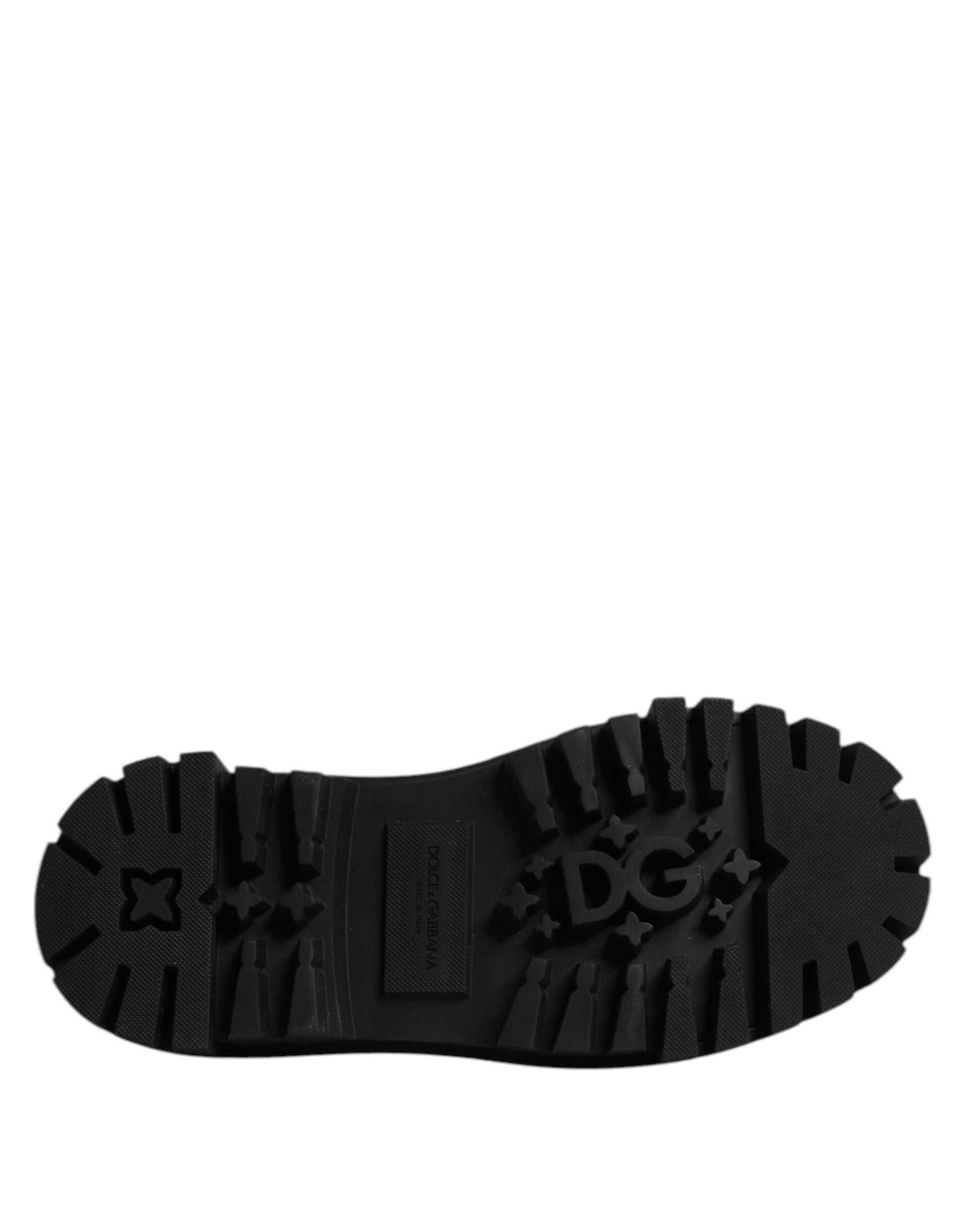 A single black leather lace-up shoe with a distinctive design on the side