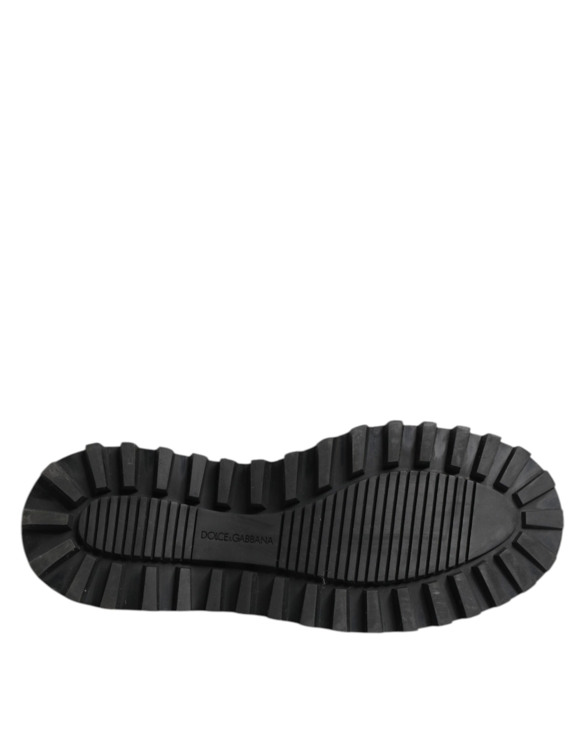 A single black leather lace-up derby shoe with a visible logo on the side