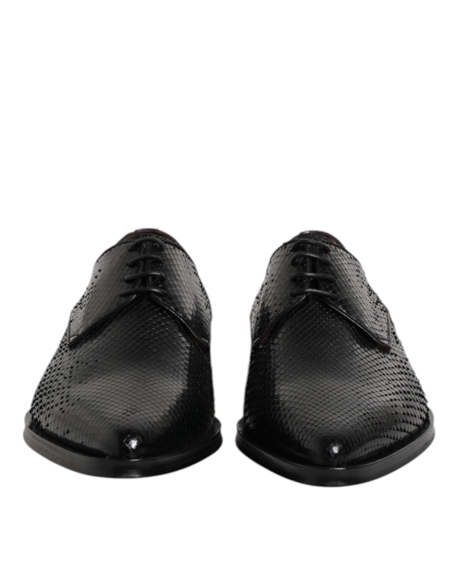 Pair of black leather lace-up dress shoes with a textured pattern on the toe cap