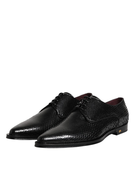 Pair of black leather lace up dress shoes with red accents, designed by Dolce & Gabbana