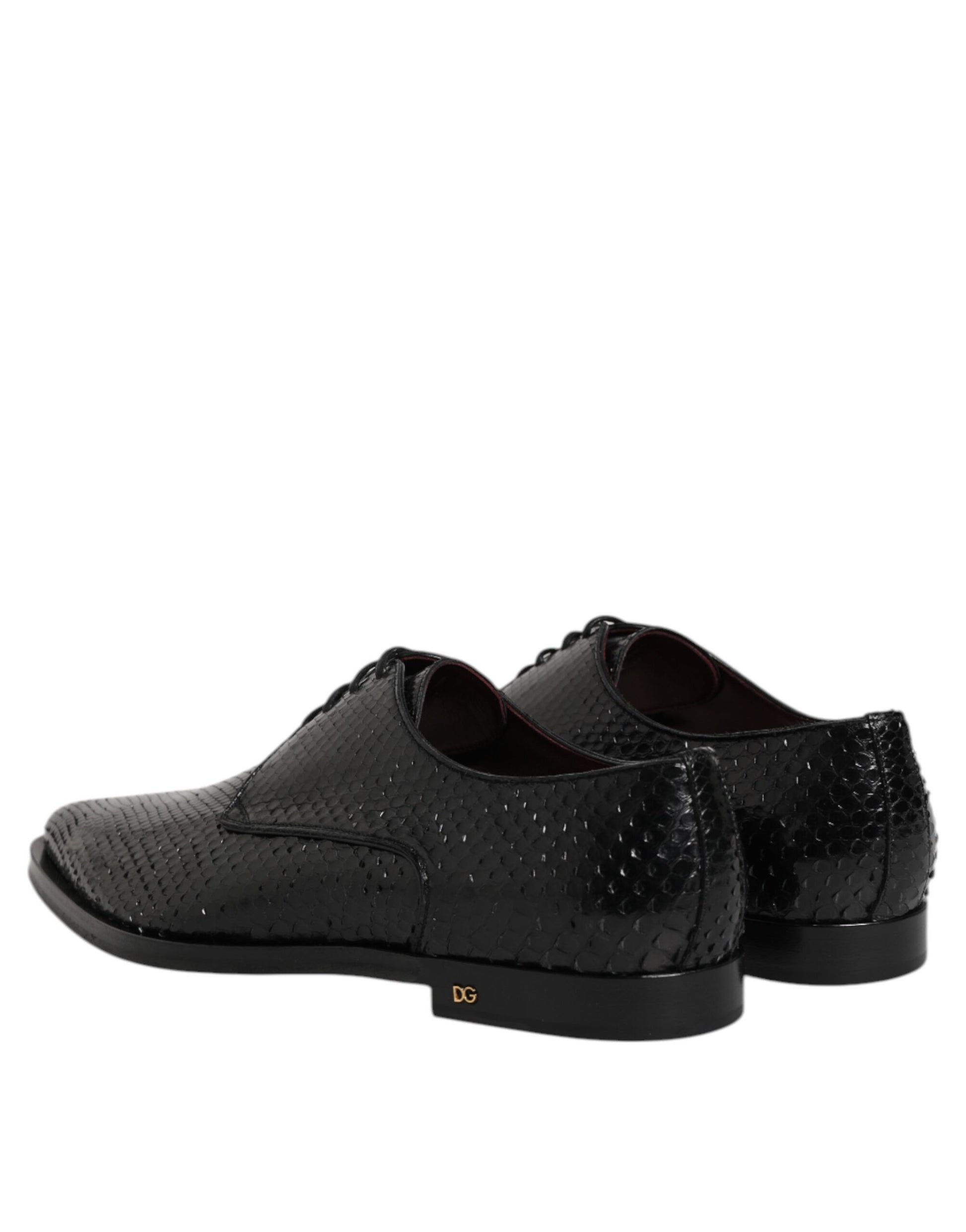 Pair of black leather lace-up dress shoes with silver buckle detail