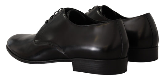 Pair of black dress shoes with laces