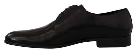 Pair of black dress shoes with laces