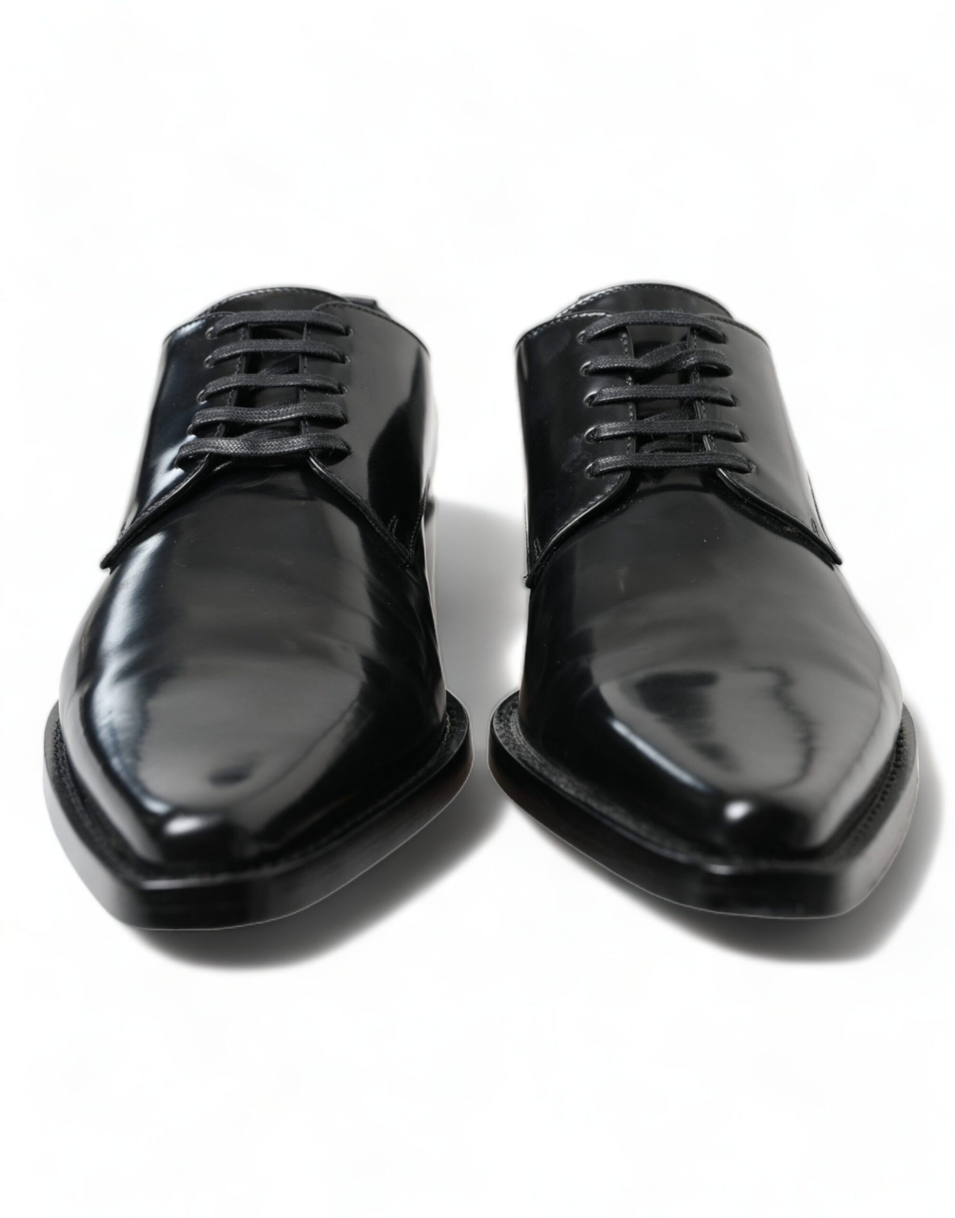 Pair of black dress shoes with laces and a shiny finish